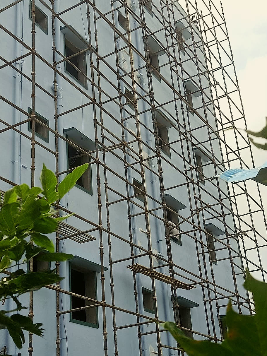 Building facade with scaffolding during finishing work